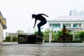 Skater boy under Rama 8 Bridge Bangkok