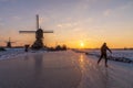 Skater on the frozen canal along the windmills alignment