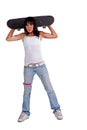 Skater girl holding skateboard behind her head Royalty Free Stock Photo