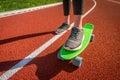 Skater girl rides on penny board Royalty Free Stock Photo