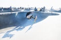 Skater jumping at halfpipe with backlight at Venice Beach skatepark, Venice Beach, Los Angeles, California