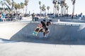 Skater jumping at Venice Beach skatepark, Venice Beach, Los Angeles, California