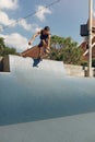 Skater Man Skateboarding On Concrete Ramp At Skatepark. Handsome Guy In Casual Outfit Riding On Skateboard Outdoor Royalty Free Stock Photo