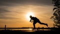 Skater on road make wide pushing against the sunset Royalty Free Stock Photo