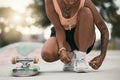 Skater, shoes and tying laces with skateboard in park to skate for fun, exercise and training outdoors. Fitness, woman Royalty Free Stock Photo