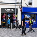 Skater Skate Boarding Outside A Costa Coffee Shop