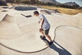 Skater, sports and man at skate park in city performing action trick or stunt. Fitness, skateboarding and young male Royalty Free Stock Photo