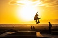 A skater in Venice Beach performs a jump Royalty Free Stock Photo