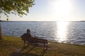 Skater watching a sunset sitted in a bench