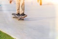 Skaters practicing long board riding outdoors in skateboarding park in sunny day. Active urban life. Urban subculture. Royalty Free Stock Photo