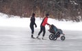 Skaters With Baby Carriage On Frozen Pond