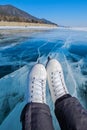 Skates close up on the ice of a frozen lake. Winter landscape, sunny day, atmosphere of fun winter activities. Royalty Free Stock Photo