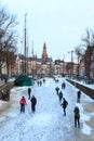 Skating on a canal in a city