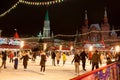 Skating ring full of locals and tourists on Red Square during Christmas time.