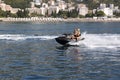 Skating by the sea on a water scooter