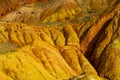 Colorful striped mountains, yellow and different color painted hills Royalty Free Stock Photo