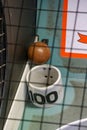 A skee-ball is wedged stuck by the 100 point hole Royalty Free Stock Photo