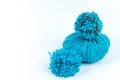 Skein of blue threads for knitting on a white background. pompon. fluffy soft pompon made of yarn Royalty Free Stock Photo