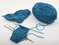 Skein of blue wool and knitting needls