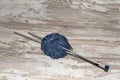 Skein of blue wool with needles on rustic background with copy space Royalty Free Stock Photo