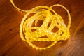 Skein of led strip with warm yellow light close-up