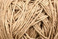 A skein of linen string, cord isolated. Coil of twine. Jute rope. Hemp thread isolated. A skein of brown wool for knitting on a Royalty Free Stock Photo