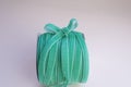 A skein of velvet green ribbon for floristics and gift wrapping with a cute bow on the side