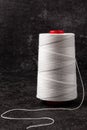A skein of white thread on a black background Royalty Free Stock Photo
