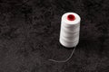 A skein of white thread on a black background Royalty Free Stock Photo