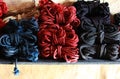 Skeins of 6mm diameter jute rope for Japanese bondage and shibari. Blue, red, black and undyed ropes at the bdsm fair at Royalty Free Stock Photo