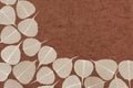 Skeletal leaves over brown handmade paper Royalty Free Stock Photo