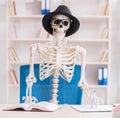 Skeleton businessman working in the office