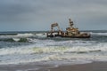 Skeleton Coast in Namibia. The shipwreck was stranded or grounded at the coastline Royalty Free Stock Photo