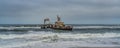 Skeleton Coast in Namibia. The shipwreck was stranded or grounded at the coastline Royalty Free Stock Photo