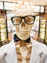 Skeleton in doctors smock with glasses and bow tie