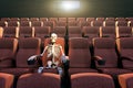 Skeleton in an empty movie theatre