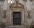 The skeleton entrance door of the church Fraternal Organization of our Lady of Suffrage in Monopoli, Italy