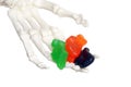 Skeleton hand offering candy