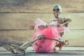 Skeleton hug gift on wood background. Royalty Free Stock Photo