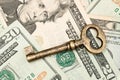 Skeleton key on cash. Royalty Free Stock Photo