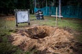 Skeleton near fresh grave with an established cross Royalty Free Stock Photo