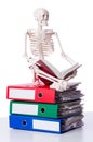 Skeleton with pile of files Royalty Free Stock Photo