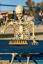 Skeleton playing chess