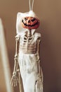 Skeleton with pumpkin head in bridal oufit