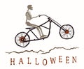 The skeleton rides a motorcycle frame on a bad road to the Halloween.