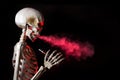 Skeleton vaping clouds of red highlighted vapor with an ecigarette Royalty Free Stock Photo