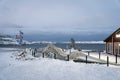 skeleton of a whale on the background of the sea in the snow in winter on the shore of the Arctic Ocean. Teriberka Murmansk region