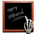 Skeleton writes Happy Halloween Royalty Free Stock Photo