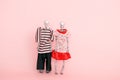 Cute skeletons in clothes on a pink background