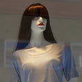 Mannequin with red lips shows summer fashion